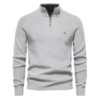 Ribbed half-zip knit sweater in light grey, long sleeves, stand collar, small chest logo.