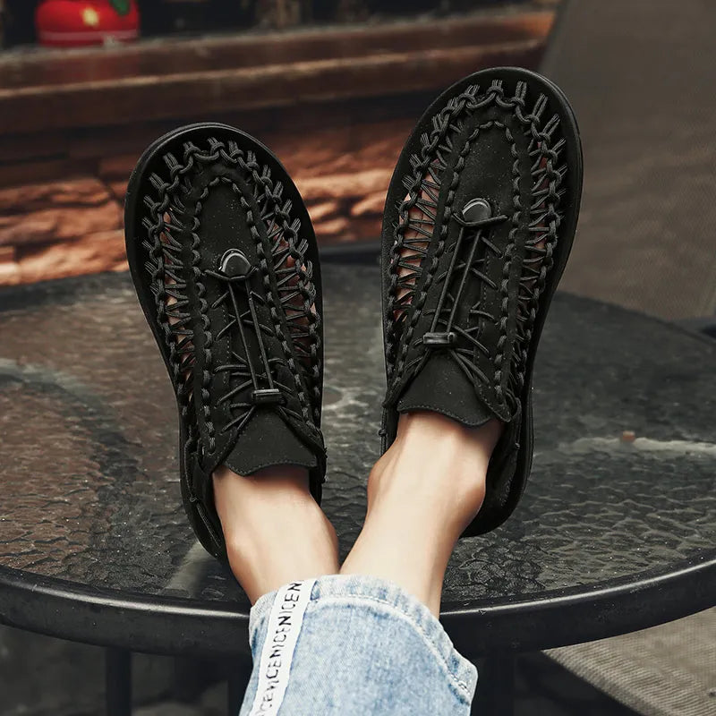 Black woven water shoes with lace-up upper and textured sole