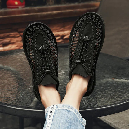 Black woven water shoes with lace-up upper and textured sole