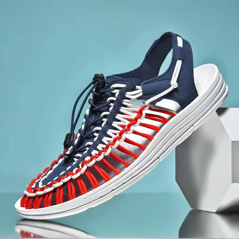 Navy woven water shoes with lace-up knit upper and red, white, and gray stripe laces