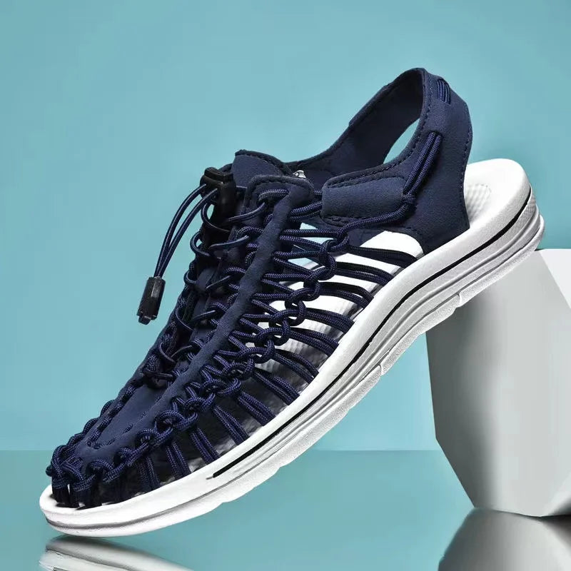 Navy woven water shoes with lace-up knit upper and thick white rubber sole