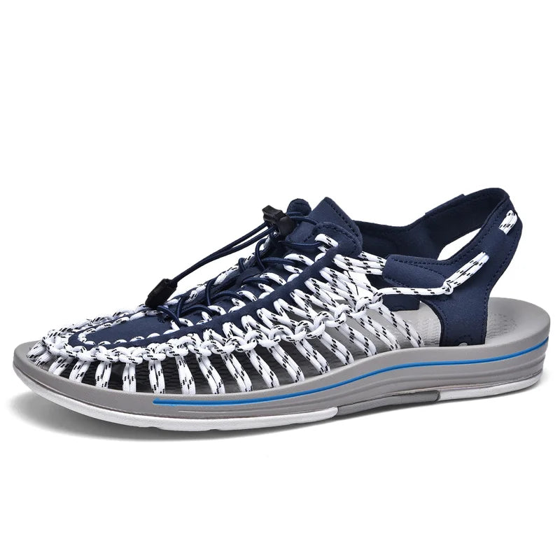 Navy woven water shoes with white striped knit laces and light gray EVA sole.