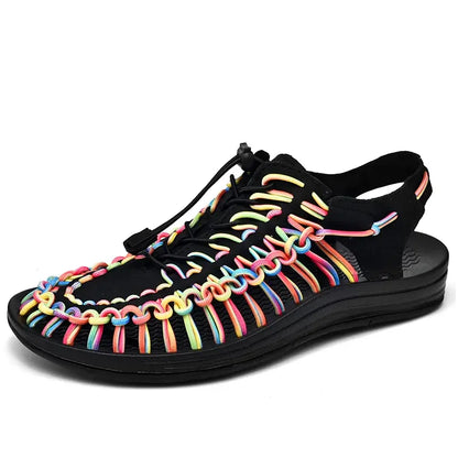 Black woven water shoes with rainbow lace-up knit straps and black EVA sole.