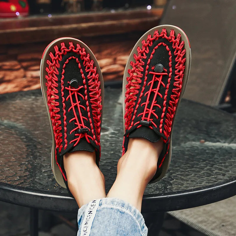 Red woven water shoes with lace-up knit upper and red stitching along the edge