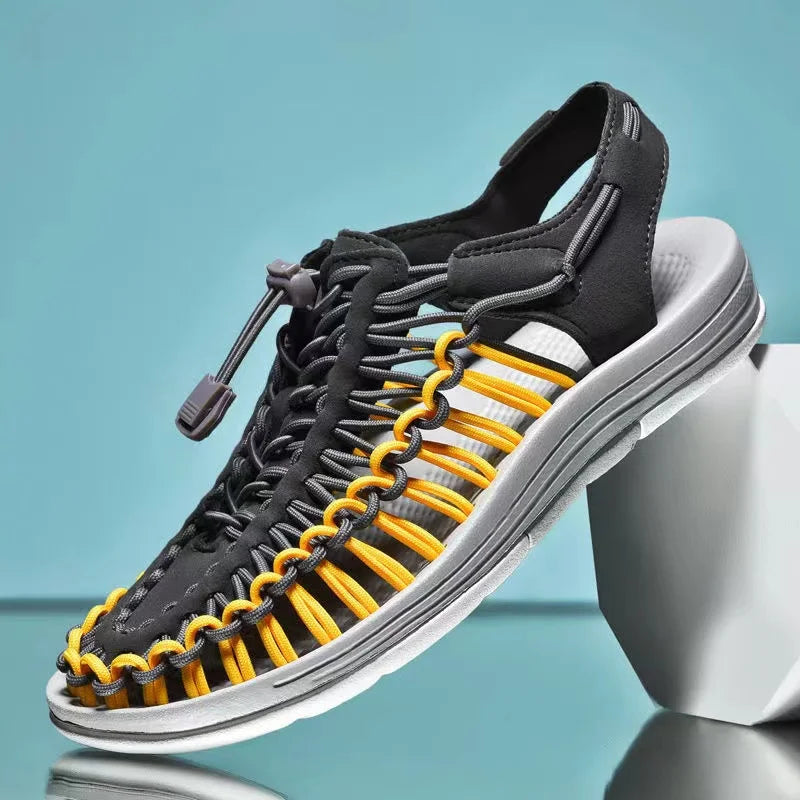 Black woven water shoes with lace-up knit upper and bright yellow accent laces