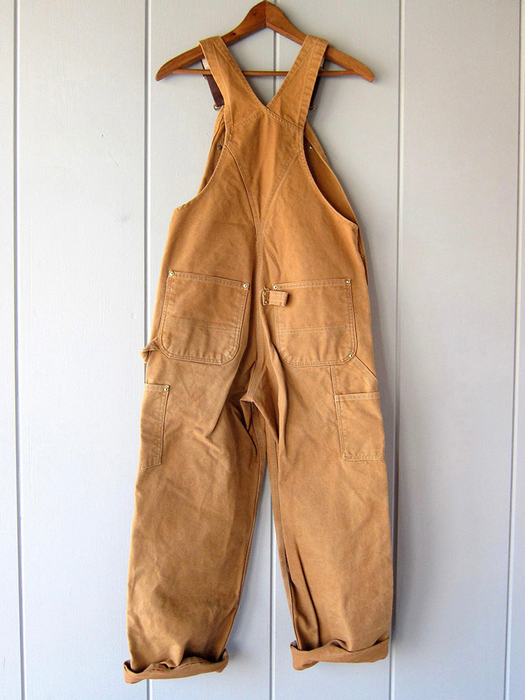 Men's camel canvas work overalls with adjustable straps, bib pocket, and legs