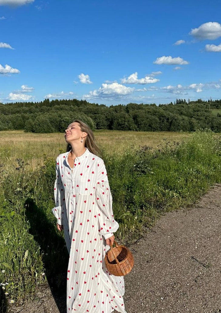 White long-sleeve maxi dress with red heart print and button-front detailing