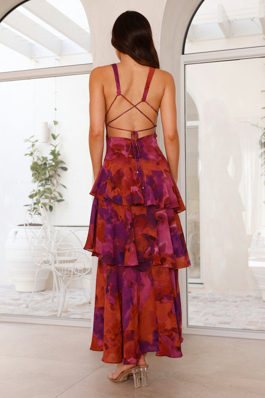 Deep V-neck maxi dress, burgundy floral, back view with crisscross straps and tiered ruffles.
