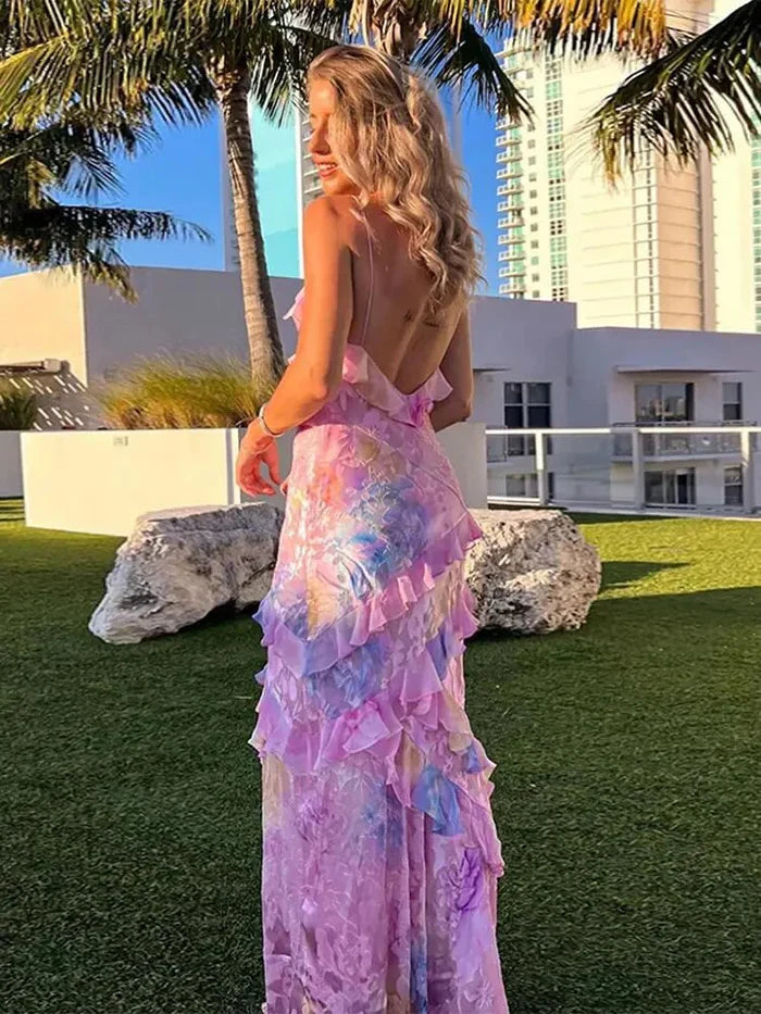 Ruffled tiered maxi dress with spaghetti straps, pastel floral print, side back view