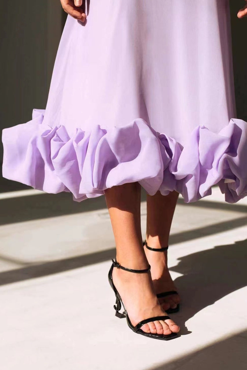 Lilac midi dress hem with gathered ruffles and spaghetti-strap A-line skirt