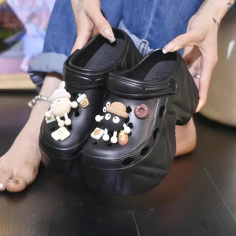Women’s black platform clogs with charm patches and thick EVA platform sole