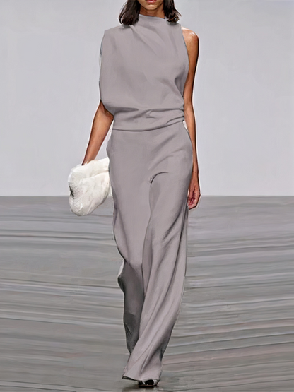 Light gray sleeveless wide-leg jumpsuit with high neckline and fitted waist.