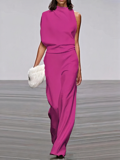 Magenta sleeveless high-neck wide-leg jumpsuit with draped waist and side cutouts