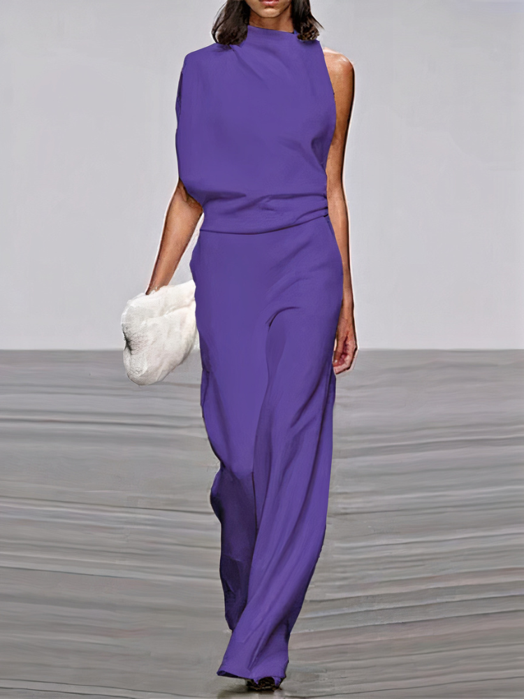 Purple sleeveless wide-leg jumpsuit with high neckline and fitted waist.