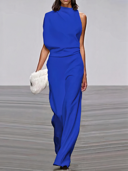 Blue sleeveless wide-leg jumpsuit with high neckline and fitted waist.