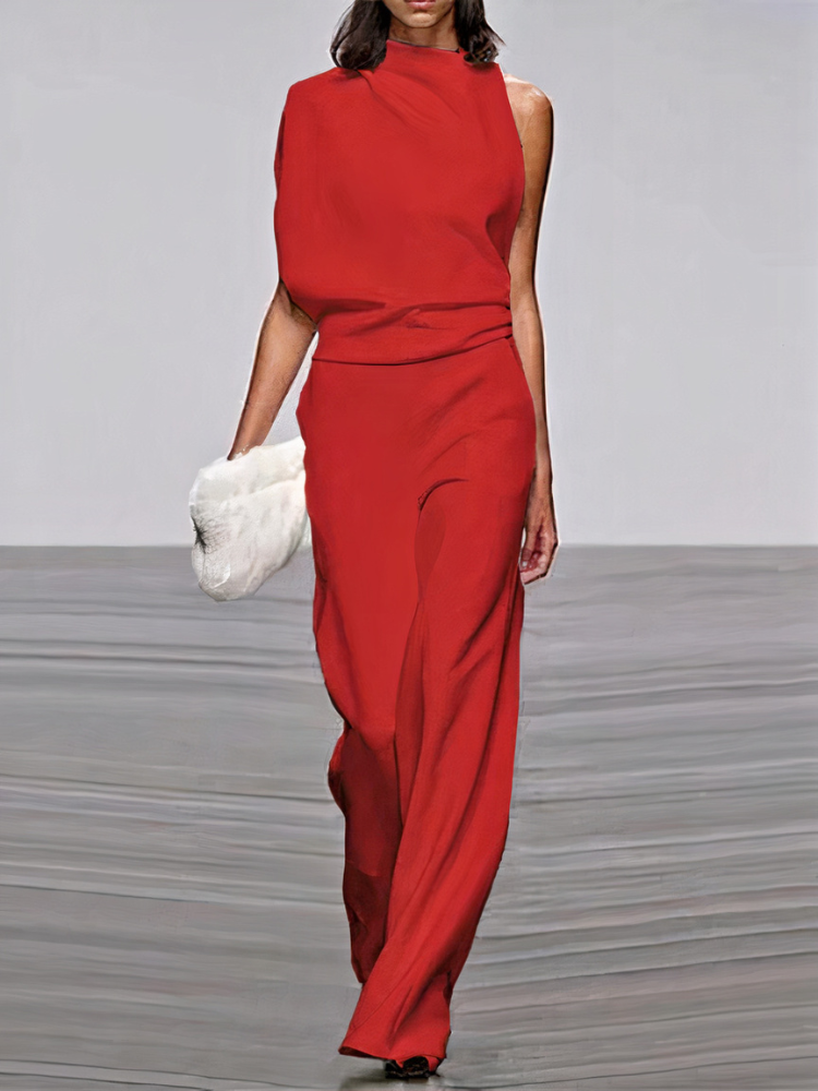 Red sleeveless wide-leg jumpsuit with high neckline and fitted waist.