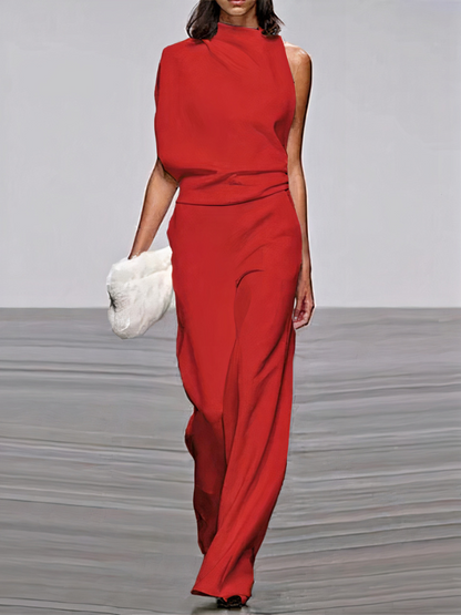 Red sleeveless wide-leg jumpsuit with high neckline and fitted waist.