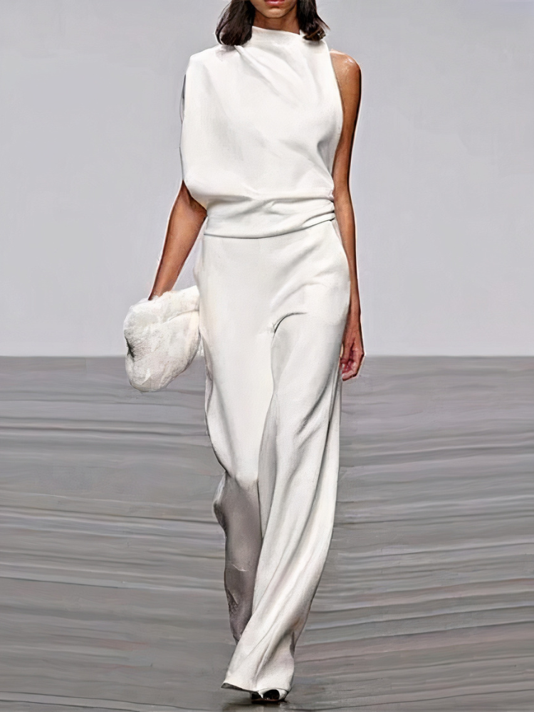 White sleeveless wide-leg jumpsuit with high neckline and fitted waist.
