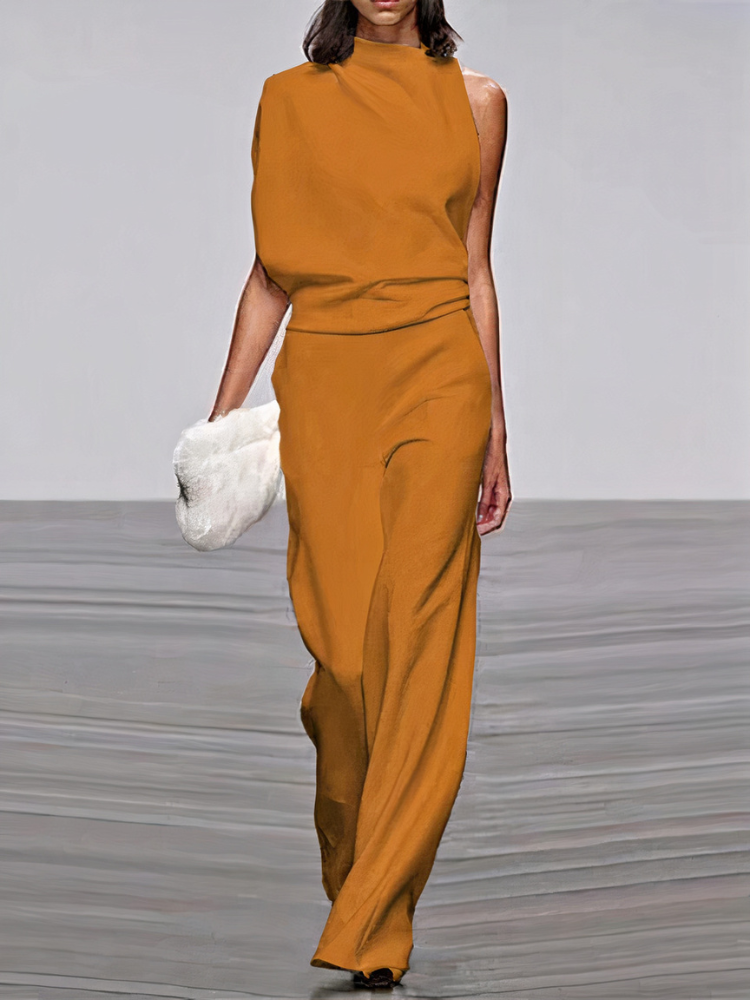 Ochre sleeveless wide-leg jumpsuit with high neckline and fitted waist.