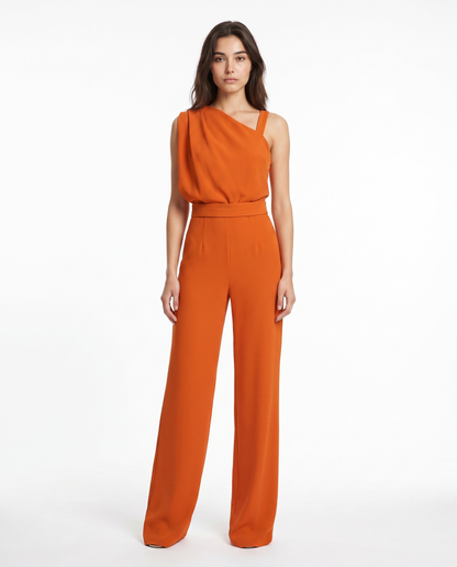 Orange sleeveless belted jumpsuit with asymmetrical neckline and wide-leg pants.
