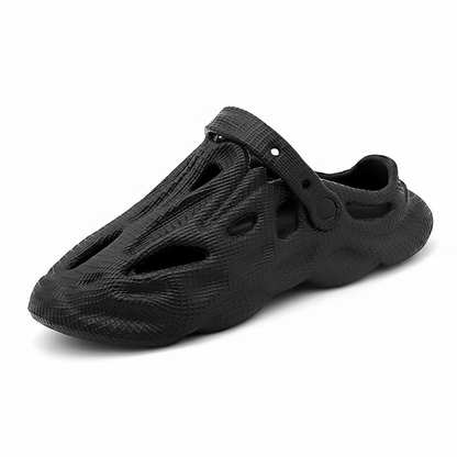 Black slip-on clogs with hollow cutouts and ventilation holes