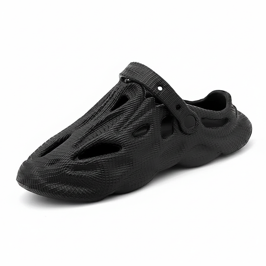 Black slip-on clogs with hollow cutouts and ventilation holes