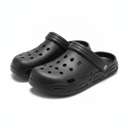 Black unisex clogs with adjustable strap detail, slip-on with perforated upper