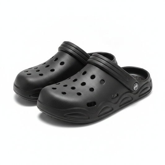 Black unisex clogs with adjustable strap detail, slip-on with perforated upper