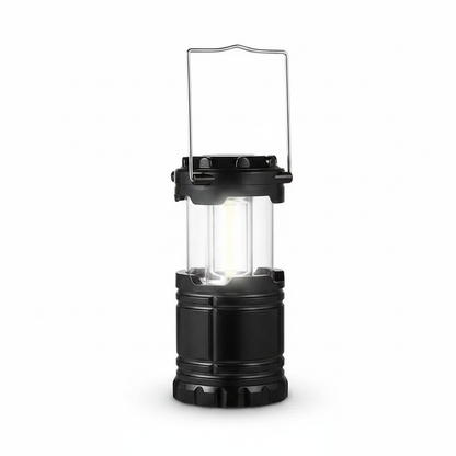 Collapsible camping lantern with clear panels and black handle, portable LED light