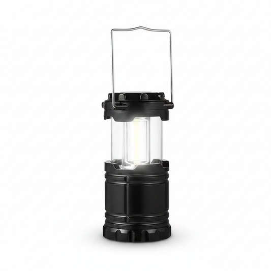 Collapsible camping lantern with clear panels and black handle, portable LED light