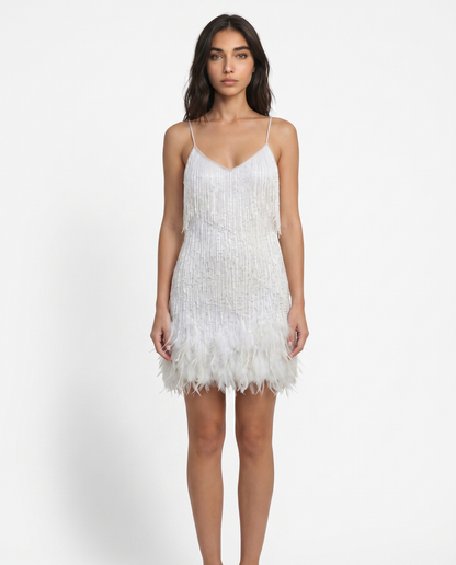 White sequin mini dress with spaghetti straps and feather fringe hem