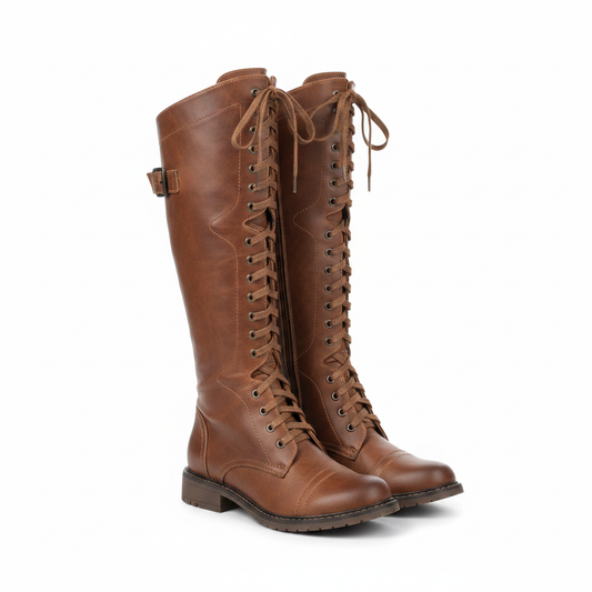 Tan-brown lace-up riding boots with side buckle, stitched shaft, and flat heel.