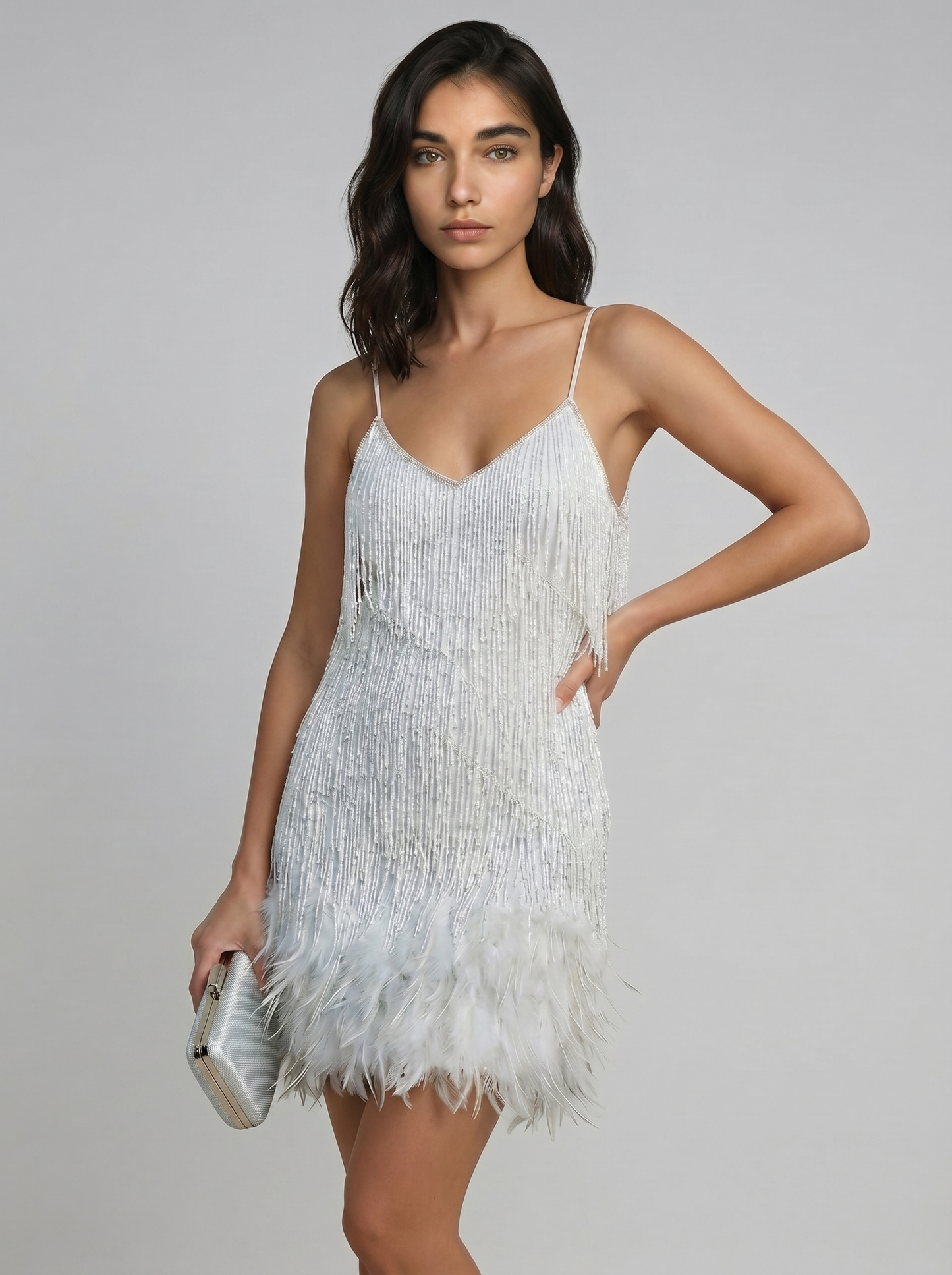 Women’s white sequin mini dress with feather fringe hem and spaghetti straps