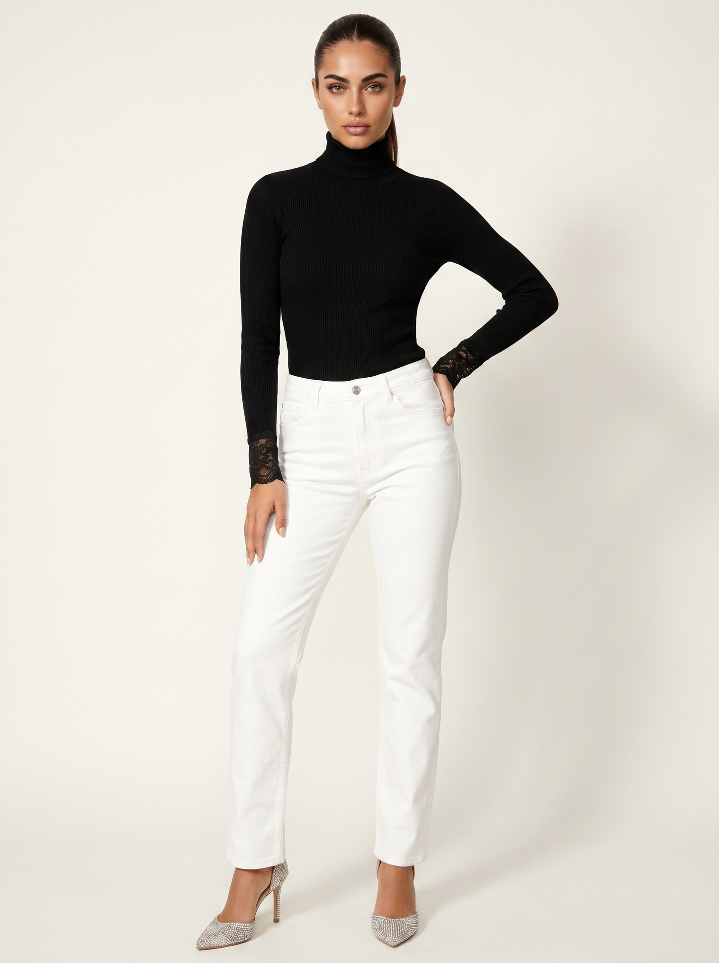 Black women's ribbed turtleneck top with lace cuffs, fitted long sleeves