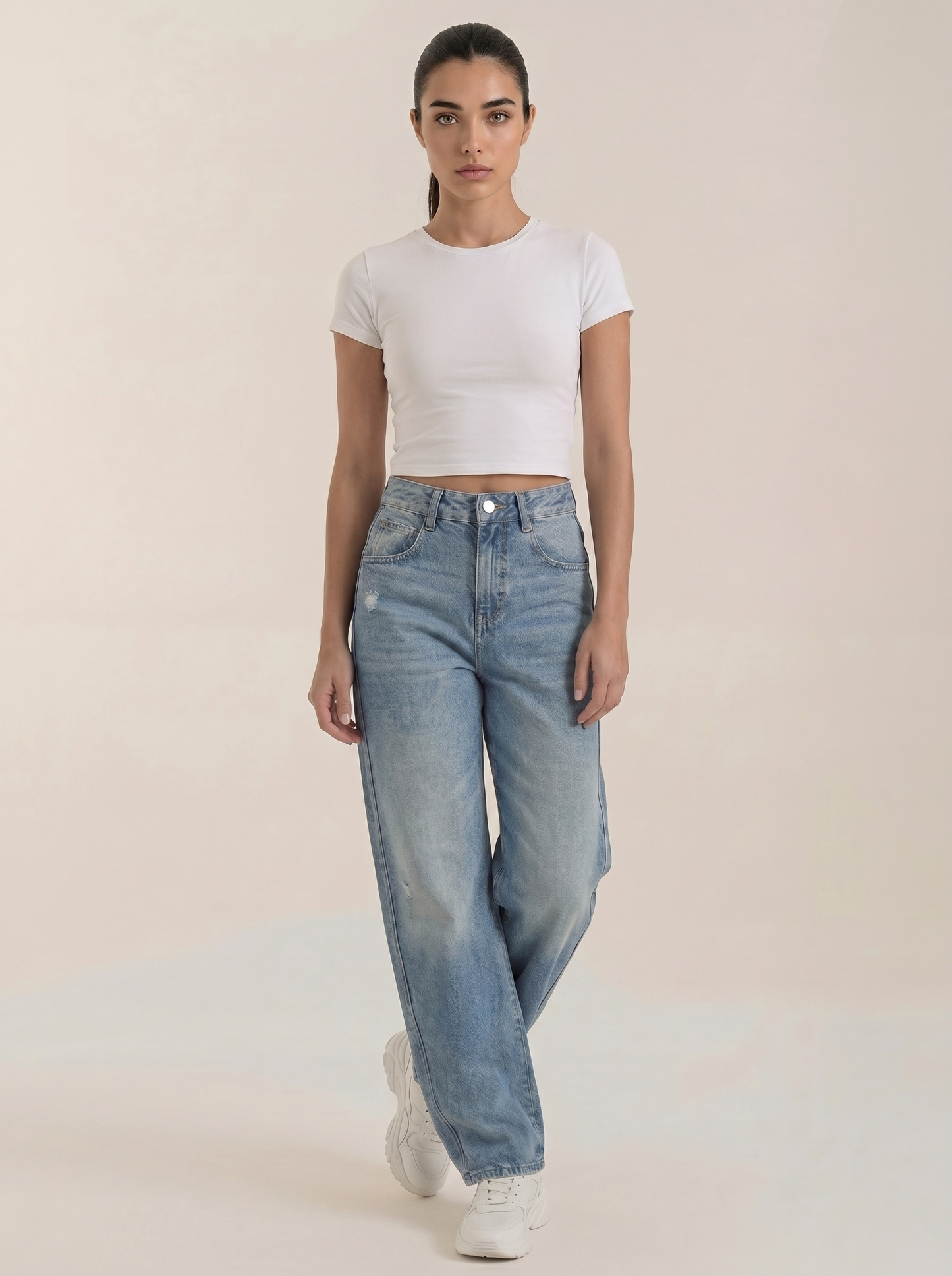 Medium blue wide-leg jeans with front button closure and washed denim finish