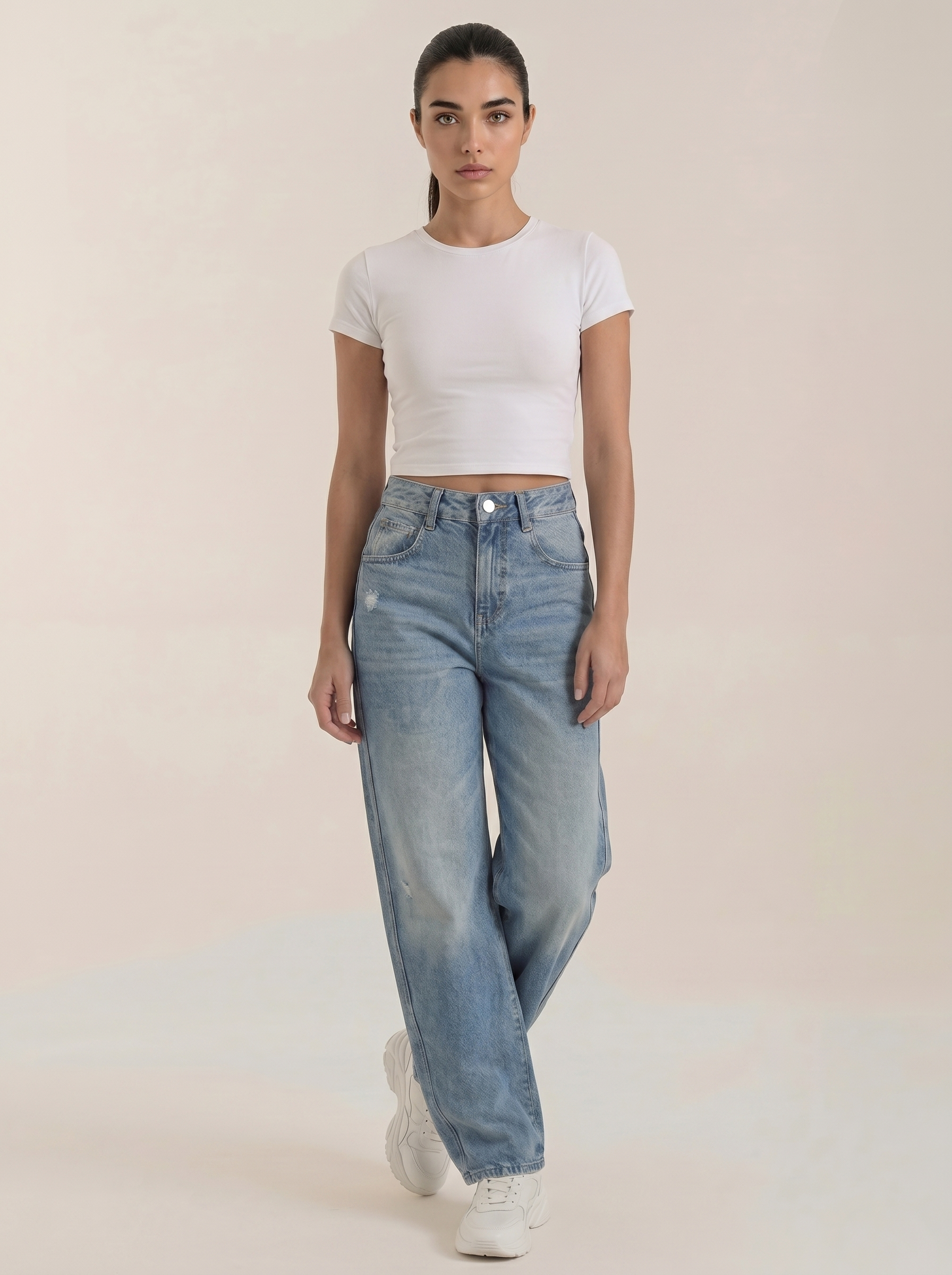 Medium blue wide-leg jeans with front button closure and washed denim finish