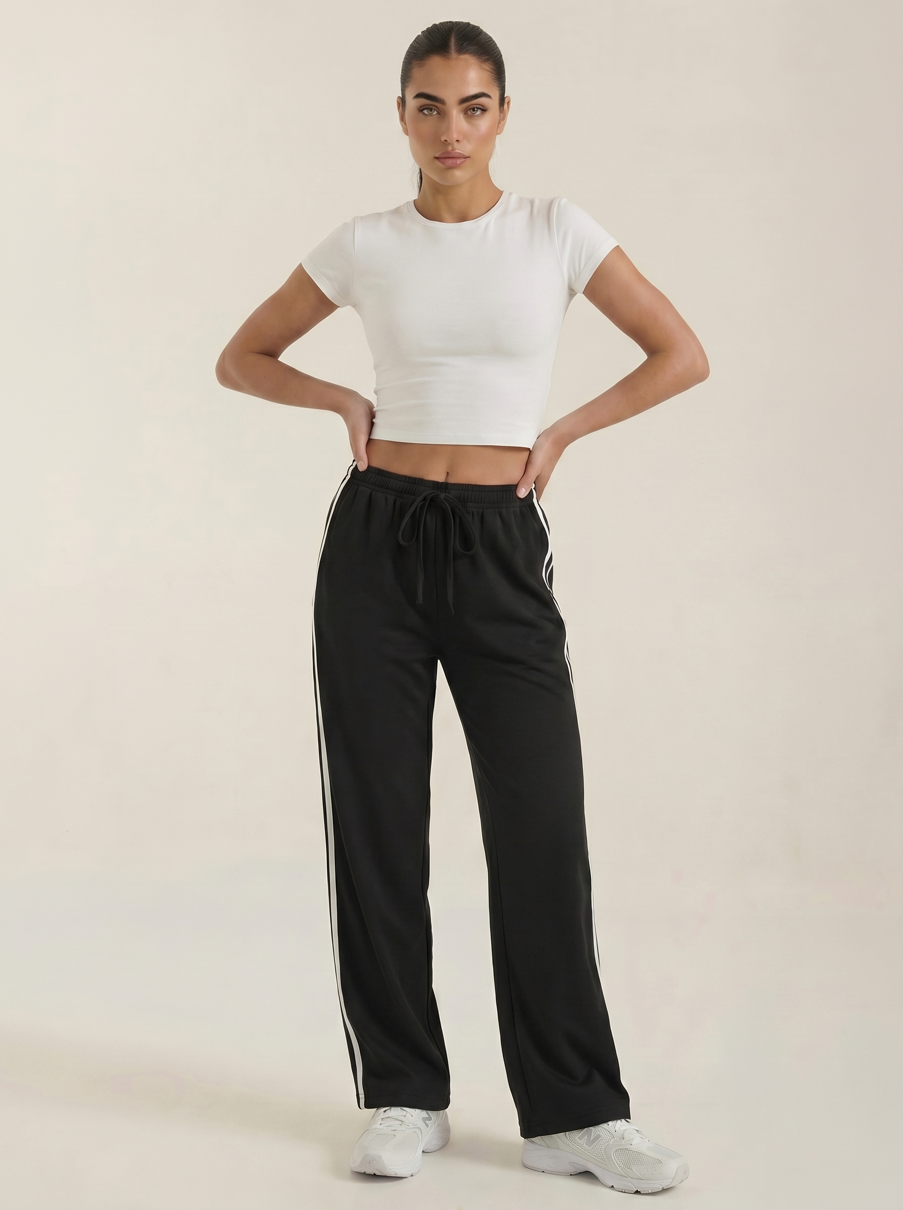 Black wide-leg track pants with side stripe, elastic waist and drawstring