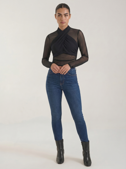 Black sheer wrap mesh top with long sleeves and crossed surplice neckline