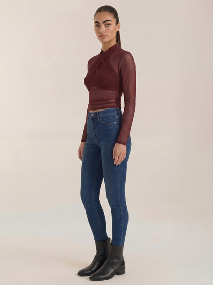 Burgundy sheer wrap mesh top with fitted long sleeves and wrap front