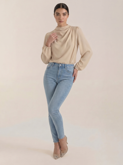 Draped long sleeve blouse in light beige satin with draped cowl neckline
