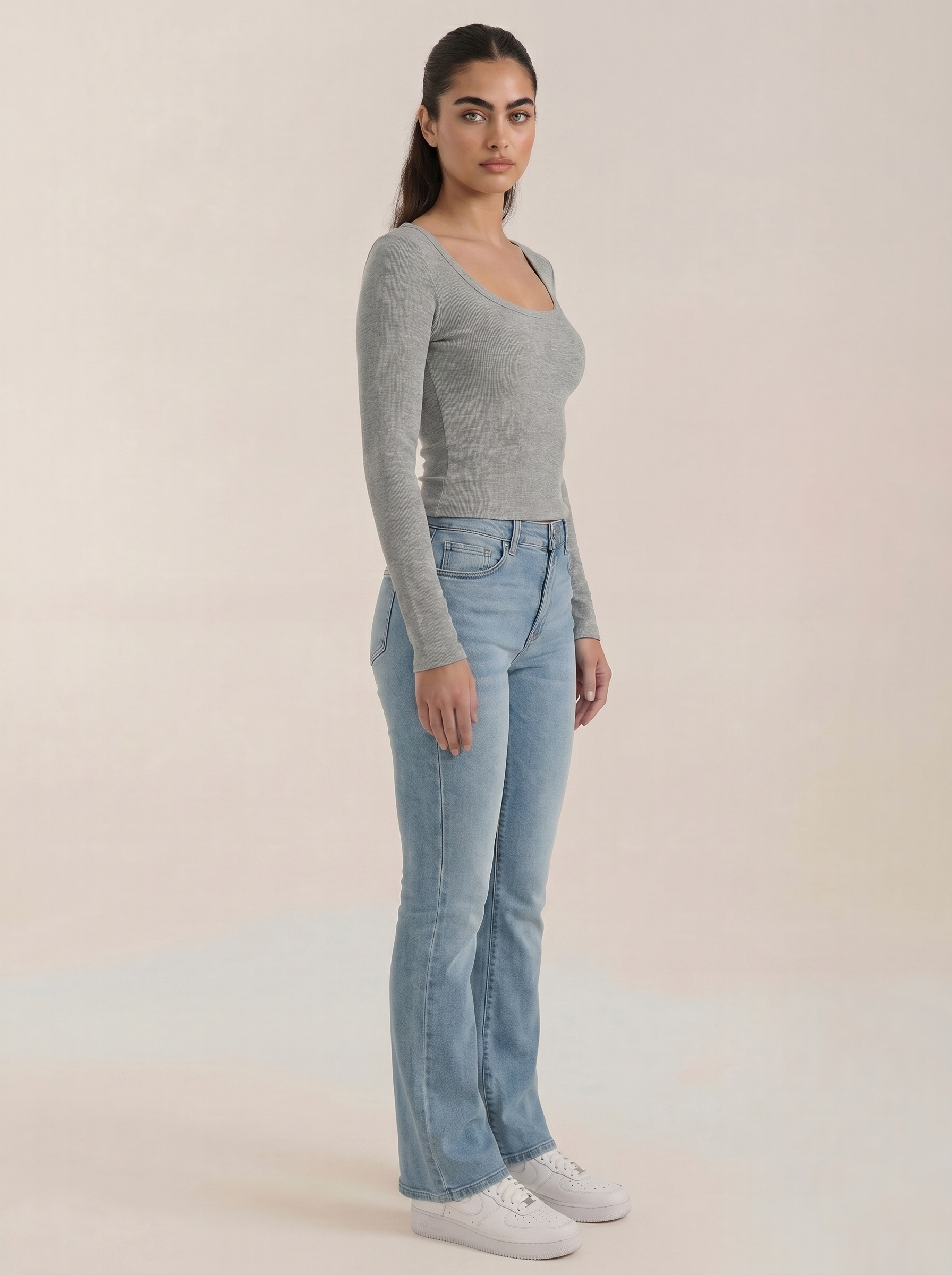 Light gray scoop-neck long-sleeve top with fitted silhouette