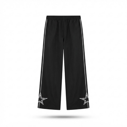 Black quick-dry trousers, flat lay: elastic waist, white side stripe with star graphics.