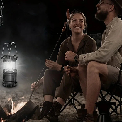 Collapsible LED camping lantern with glowing white light and foldable metal handle