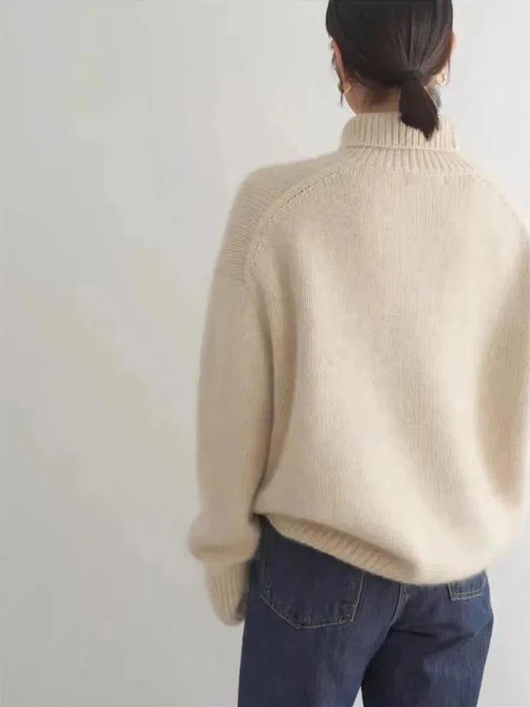 Ribbed turtleneck sweater in cream, back view with high collar