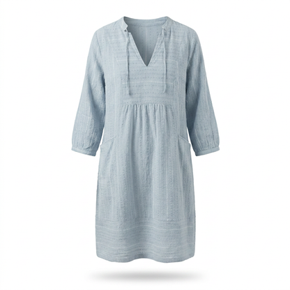 Light blue V-neck tunic dress with textured bodice, gathered skirt, 3/4 sleeves